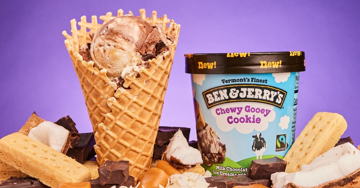 A photo of Ben & Jerry's Chewy Gooey Cookie in a caramel-lined waffle cone and cup