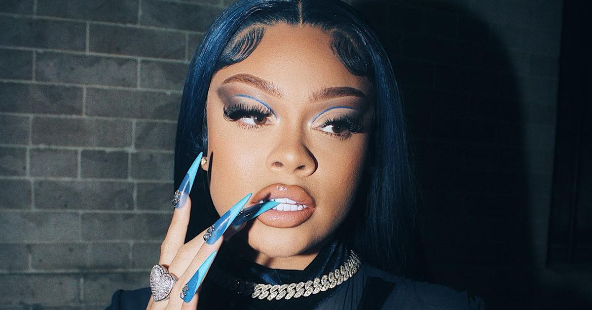 Rapper Mulatto biting her fingernail