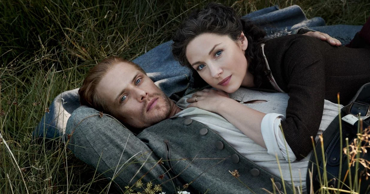 Sam Heughan's Jamie Fraser and Caitríona Balfe's Claire Randall of the Starz series Outlander lying on the ground