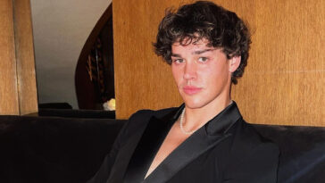 Noah Beck in black suit