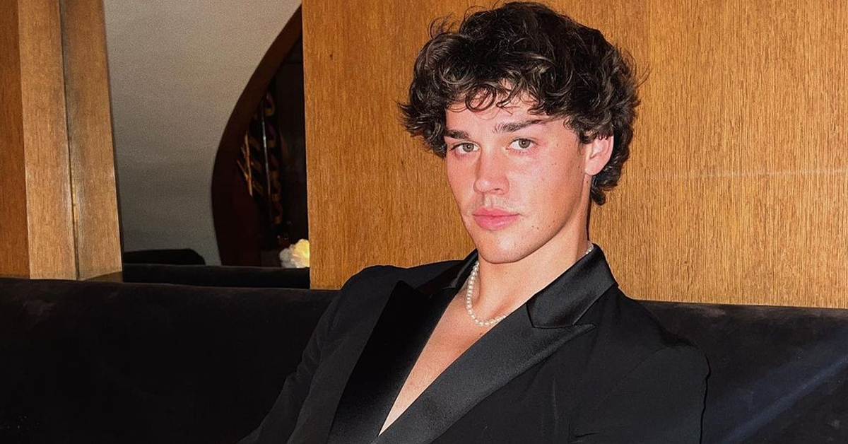 Noah Beck in black suit