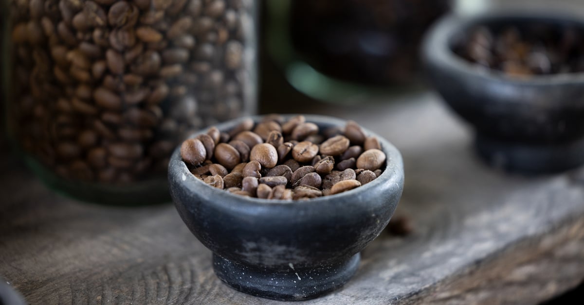 A cup of coffee beans sourced for Dunkin'