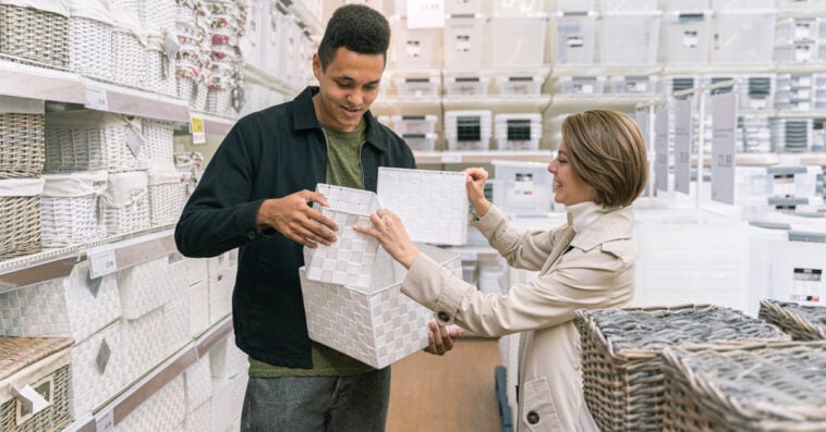 Man and woman shopping for homeware. Find out which U.S. retailers won't likely survive a recession.