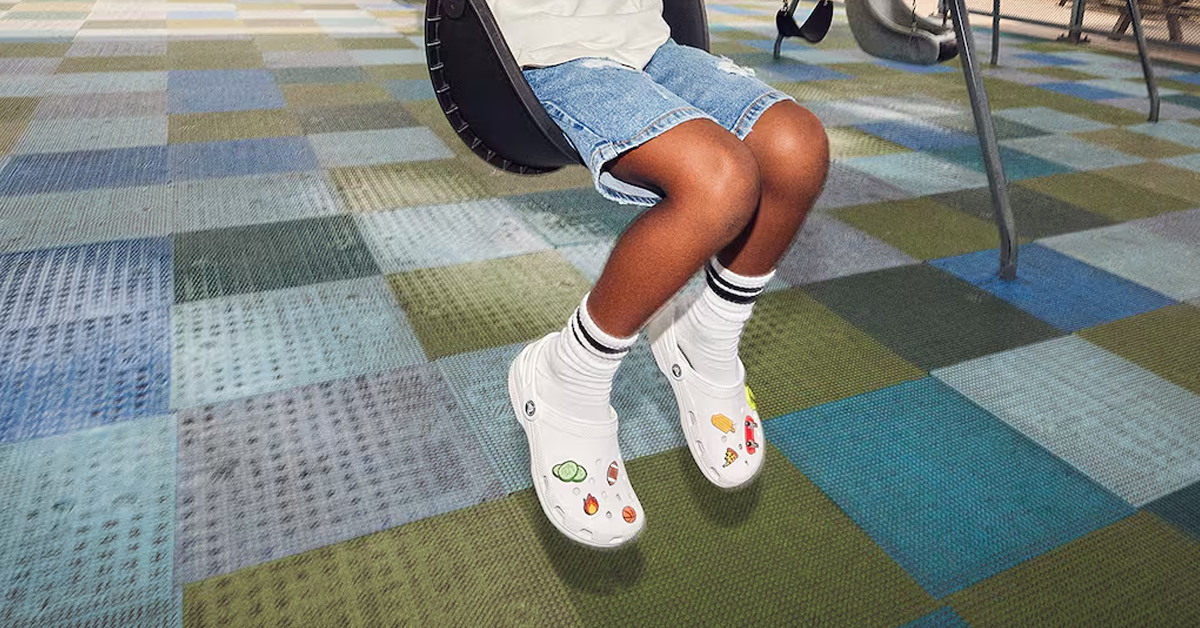 A kid wearing a pair of Crocs classic clog | ©Image Credit: DSW