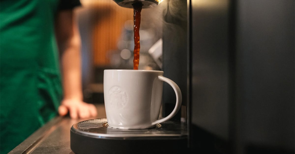 A ceramic Starbucks mug getting a hot coffee refill | ©Image Credit: Starbucks