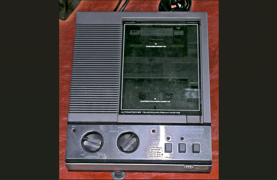 A Panasonic answering machine with a dual compact cassette tape drive to record and replay messages