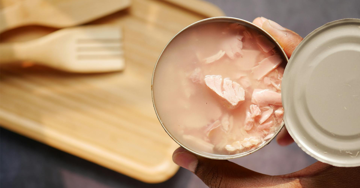 A person holding a can of tuna | ©Image Credit: Towfiqu barbhuiya/Pexels