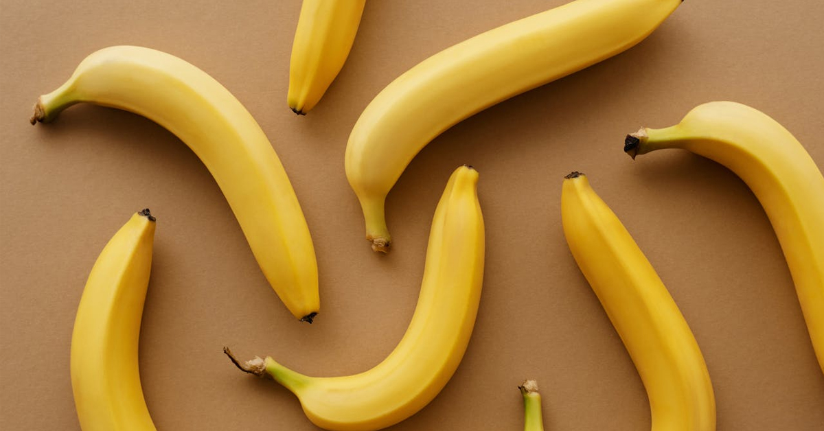 Yellow bananas on brown surface | ©Image Credit: Vanessa Loring