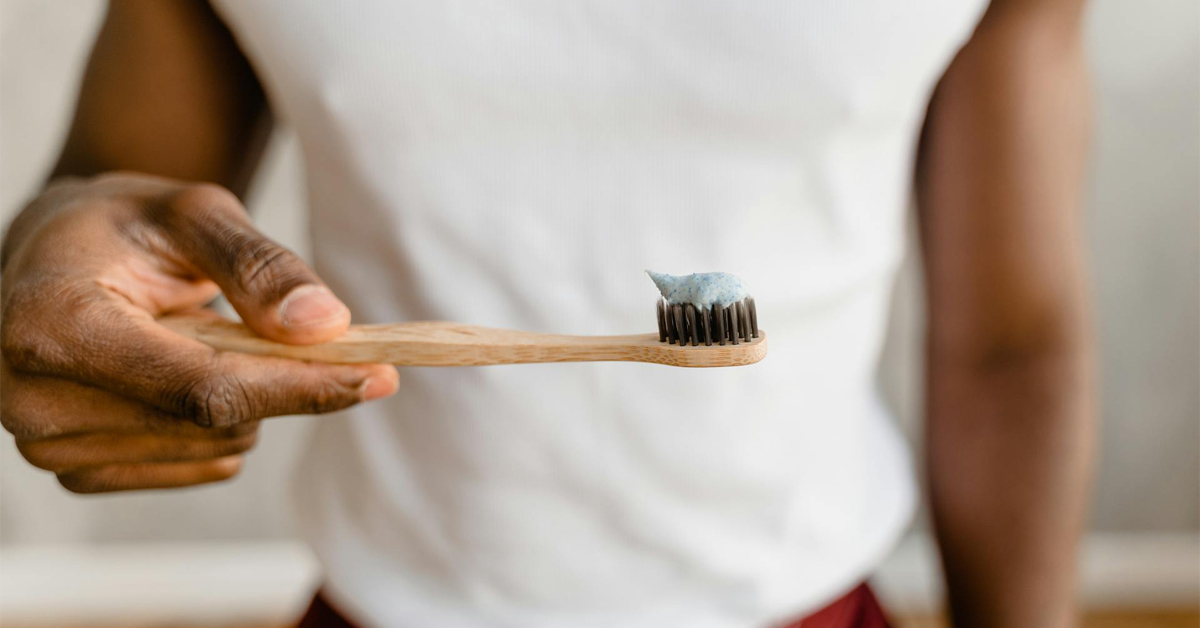 Man holding a toothbrush with toothpaste on it | ©Image Credit: Tima Miroshnichenko/Pexels
