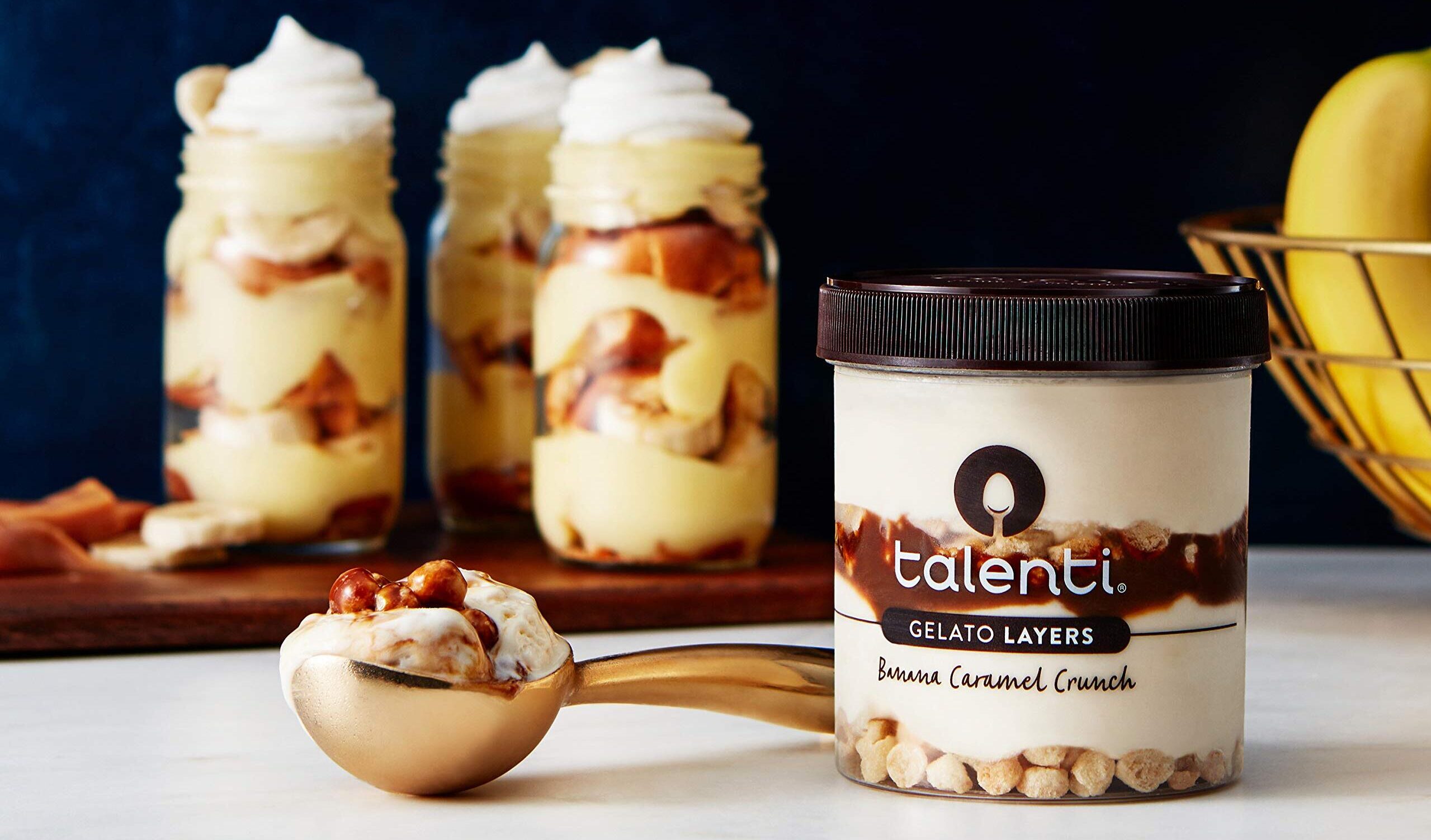 Talenti Banana Caramel Crunch Gelato Layers on a table next to a spoon | ©Image Credit: Amazon