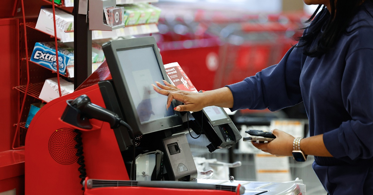 A guest completes a purchase using express self-checkout at Target | ©Image Credit: Target Corporation