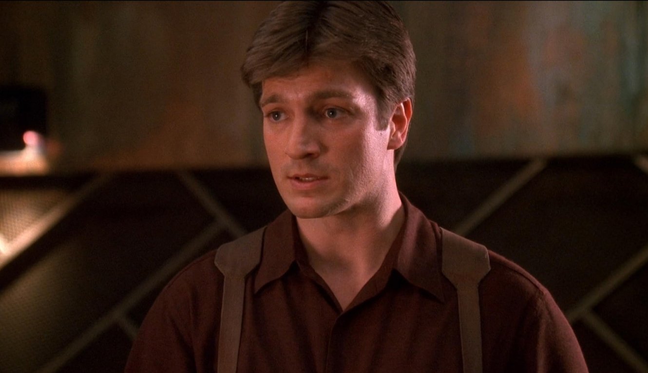 Nathan Fillion as Captain Malcolm "Mal" Reynolds in Firefly (2002) | The Walt Disney Company