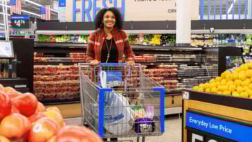 Woman shopping with a cart in Walmart | ©Image Credit: Walmart