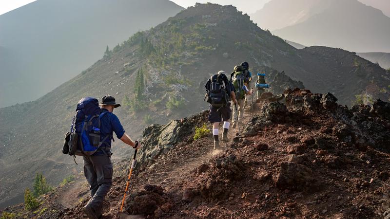 A person hiking up a trail | ©Image Credit: Pexels / Eric Sanman