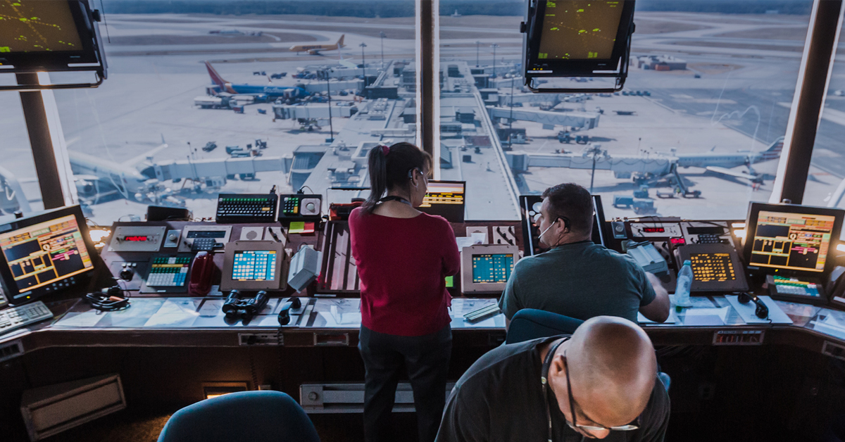 Air traffic controllers work inside a tower still reliant on aging technology—part of a nationwide system now set for a long-overdue upgrade. | ©Image Credit: FAA