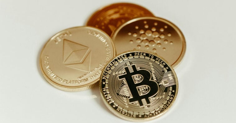 Digital currencies like Bitcoin, Ethereum, and Cardano could be seized by the State of California under AB 1052 if left inactive for three years on custodial exchanges. | ©Image Credit: Jonathan Borba/Pexels