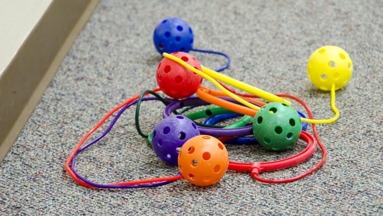 A collection of colorful Skip-It toys | ©Image Credit: Wikimedia Commons / Saskatoon Public Library