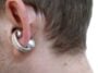 Close-up of Moto Buds Loop worn in ear showing crystal-adorned loop design