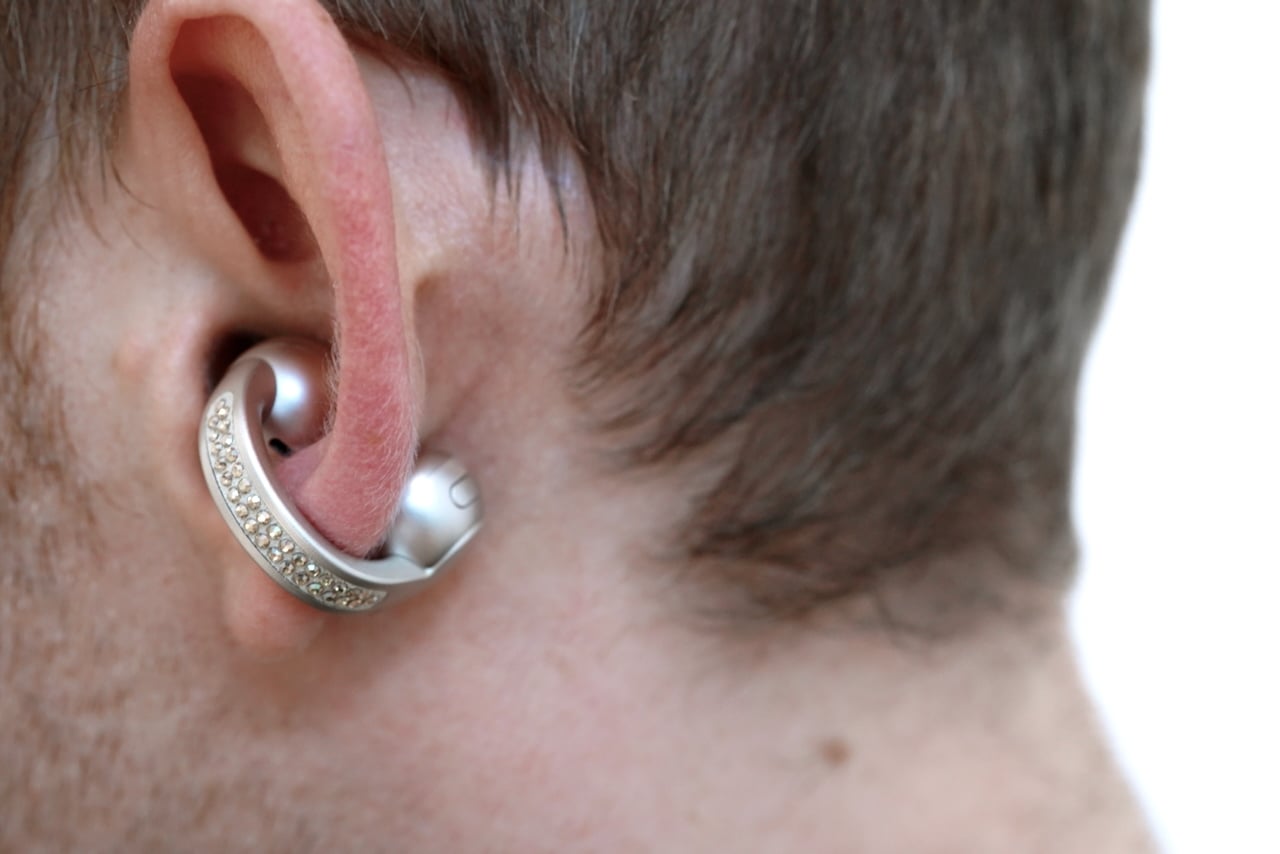 Close-up of Moto Buds Loop worn in ear showing crystal-adorned loop design