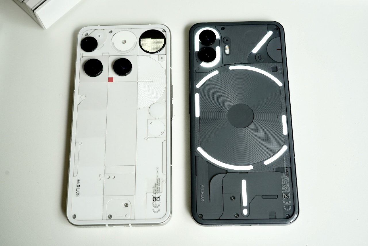 Side-by-side comparison of Nothing Phone 3 and Nothing Phone 2 showing design evolution
