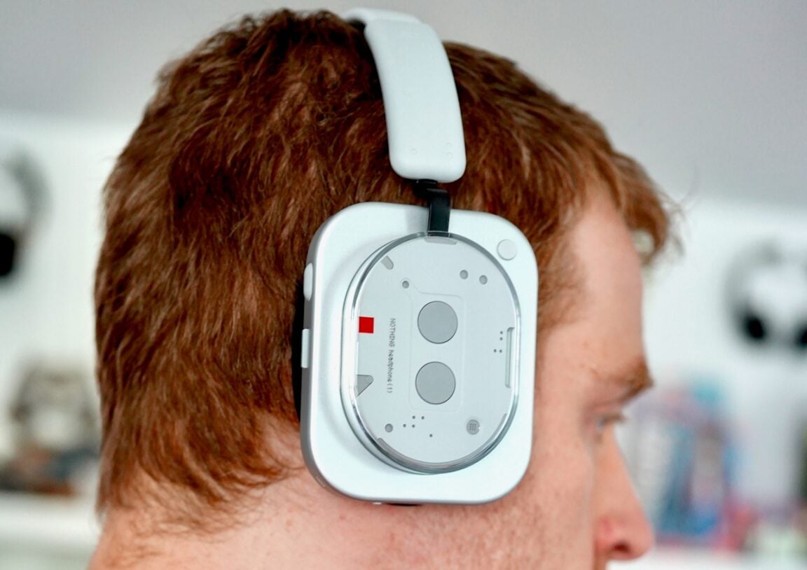 Nothing Headphone (1) Review: The glorious return of buttons and dials 2 Profile view of Nothing headphones being worn, showing the fit and ergonomic design
