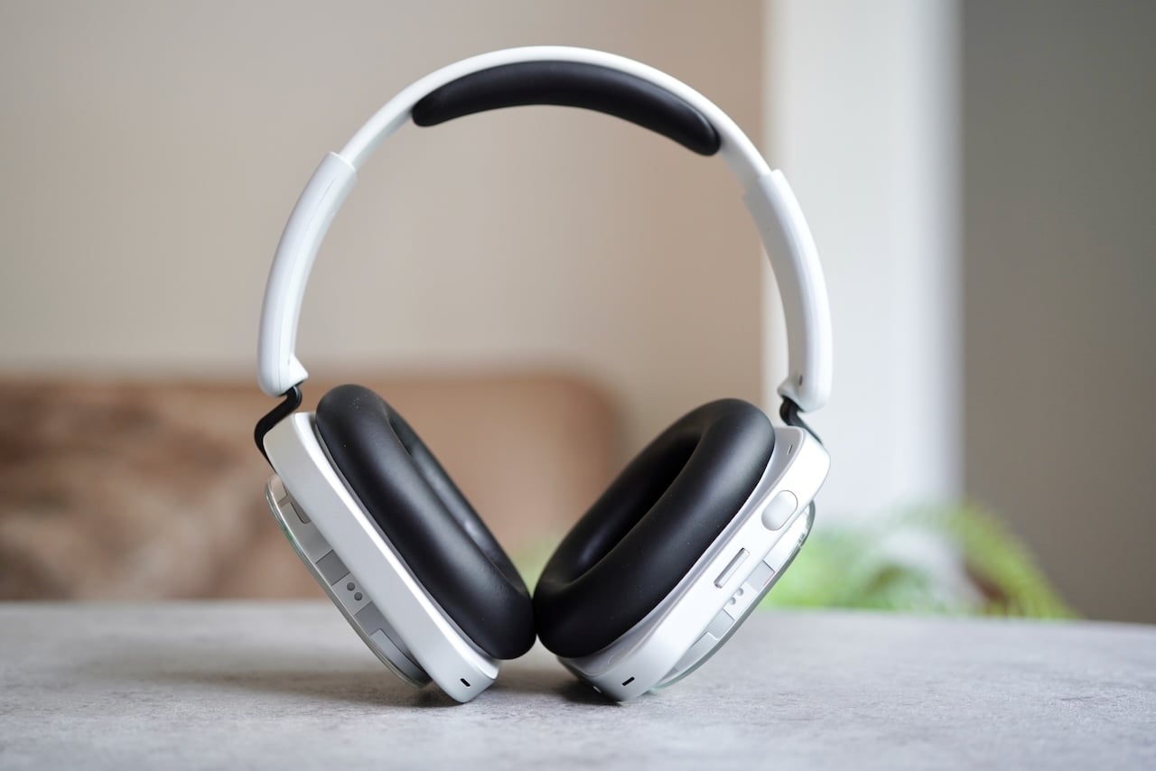 Nothing Headphone (1) Review: The glorious return of buttons and dials 3 Nothing headphones displayed upright showing their white and black minimalist design with rounded ear cups