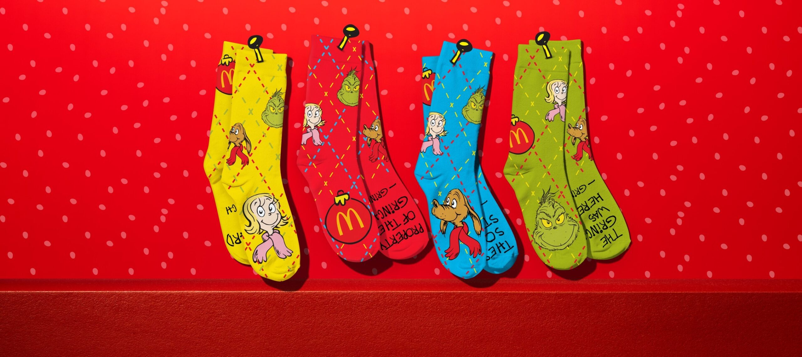 Get a pair of these spirited socks when you buy McDonald's The Grinch Meal. | ©Image Credit: The Grinch