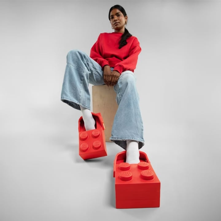 Crocs launches LEGO brick-shaped clogs for $150 2 A woman wearing a pair of LEGO Brick Clogs | ©Image Credit: Crocs