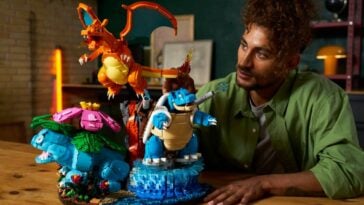 Human observing LEGO x Pokémon Venusaur, Charizard and Blastoise Set ©Image Credit: LEGO