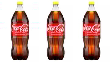 Behind the bright lid lies a 1935 secret. These yellow caps in Coca-Cola bottles represent a rich religious history and a crisp, nostalgic sugar taste. | ©Image Credit: Coca-Cola