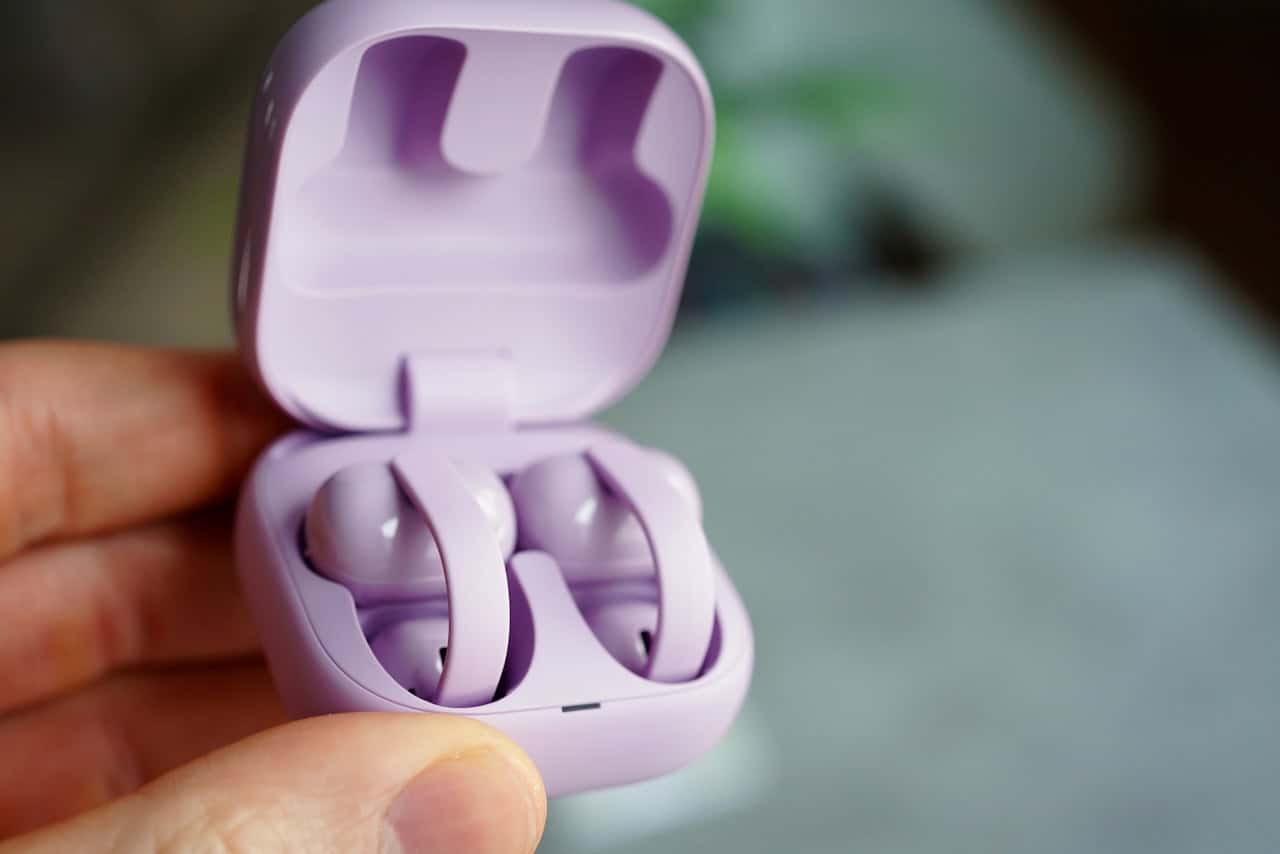 Sony Linkbuds Clip review: the open-ear trend finds its premium form 6 Hand holding the open Sony LinkBuds Clip charging case with both earbuds nestled inside