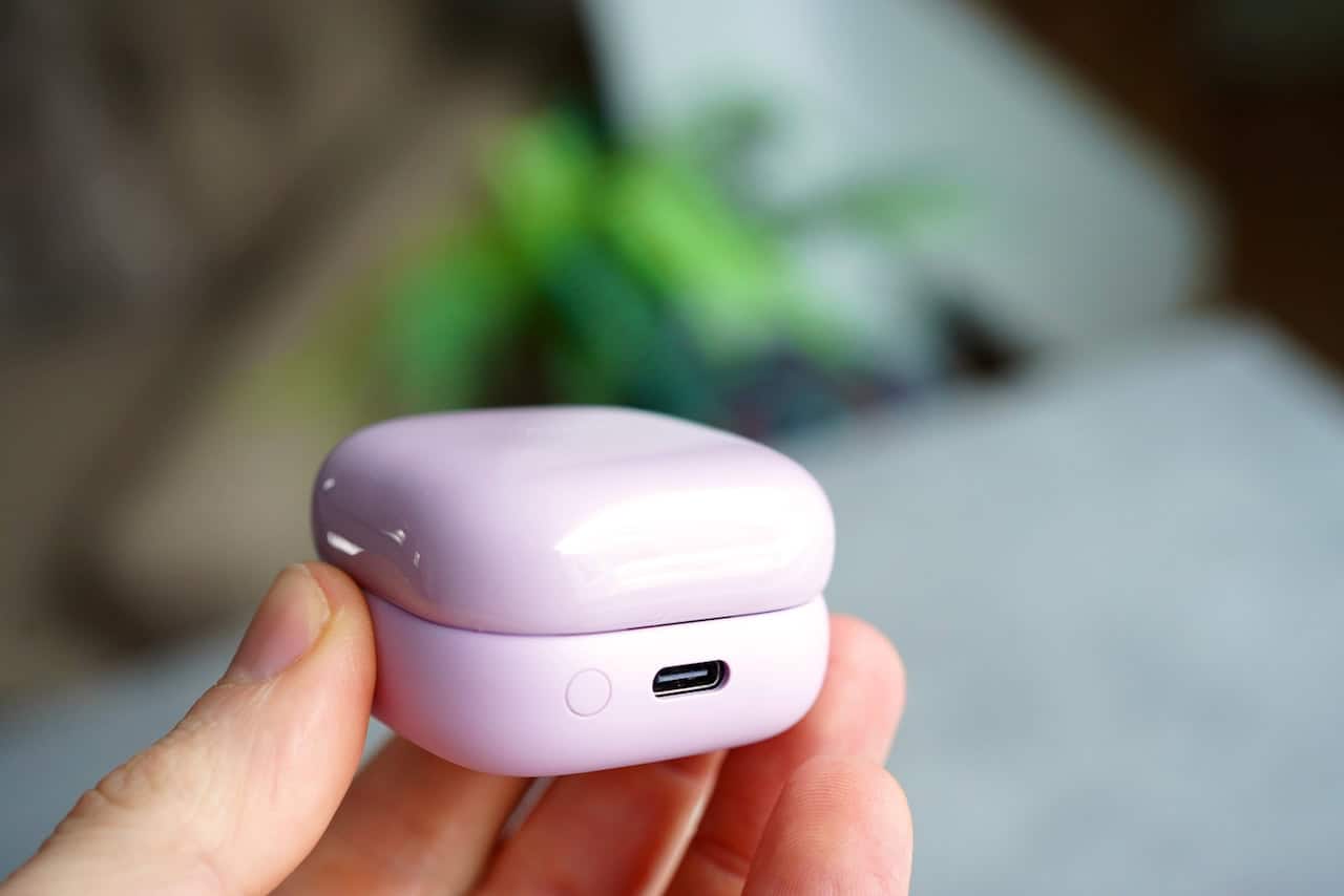 Sony Linkbuds Clip review: the open-ear trend finds its premium form 4 Hand holding the bottom of the Sony LinkBuds Clip charging case showing the USB-C port and pairing button