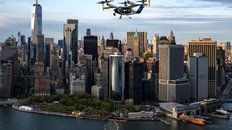 Joby electric air taxi cruises over the Manhattan skyline during its April 2026 test campaign. The company aims to launch commercial service from JFK to the city’s heliports by late 2026. ©Image Credit: Joby Aviation