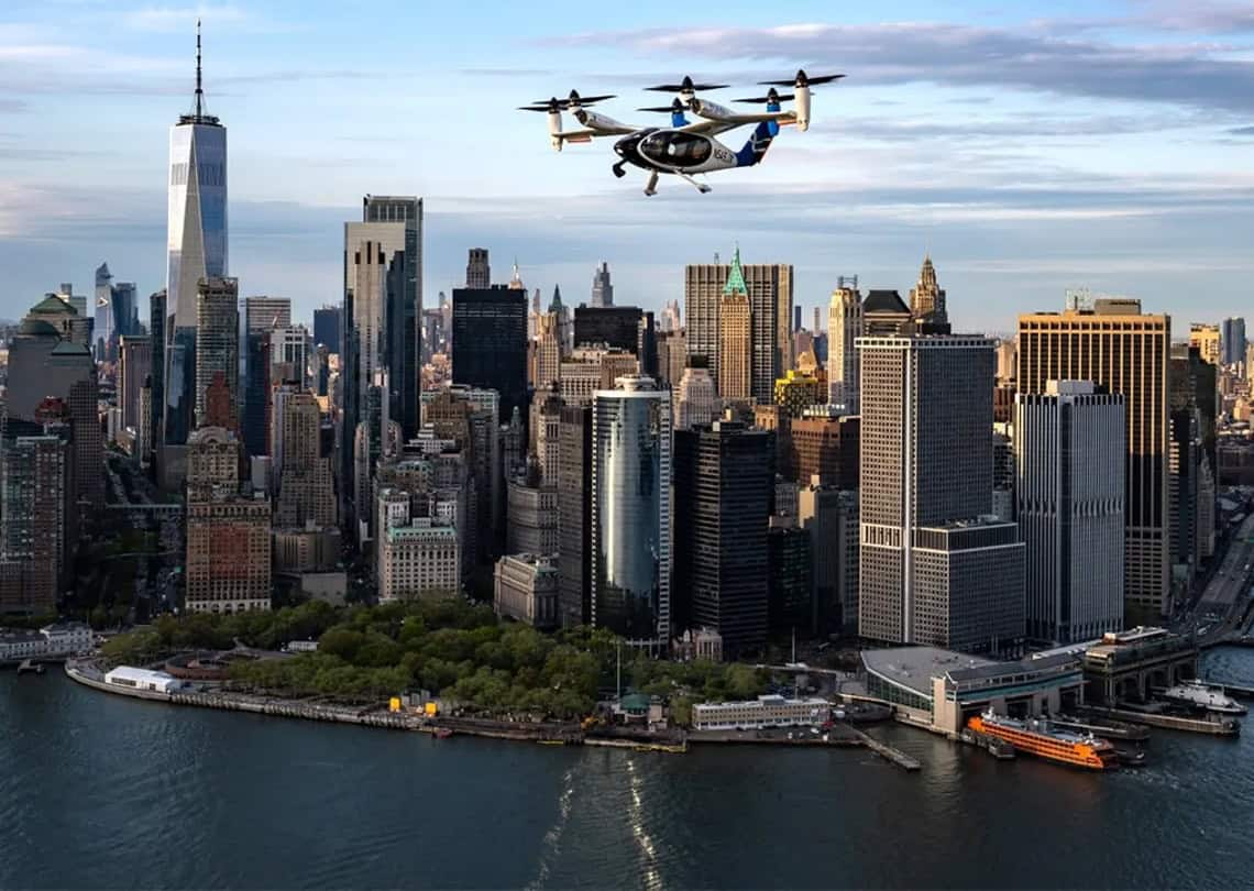 Joby electric air taxi cruises over the Manhattan skyline during its April 2026 test campaign. The company aims to launch commercial service from JFK to the city’s heliports by late 2026. ©Image Credit: Joby Aviation