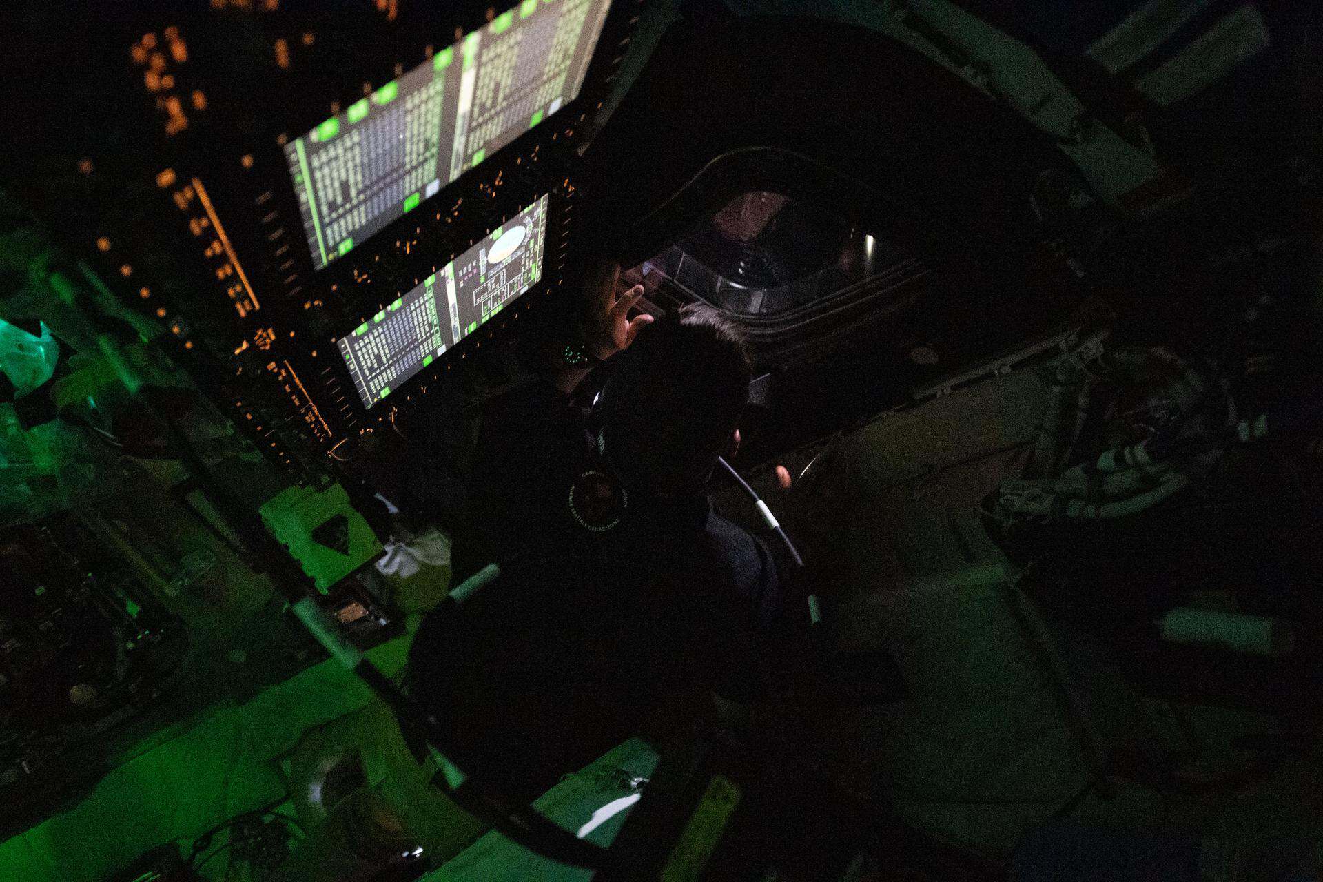 CSA (Canadian Space Agency) astronaut Jeremy Hansen peers out the window of the Orion spacecraft on day 3 of NASA's Artemis II mission. | ©Image Credit: NASA