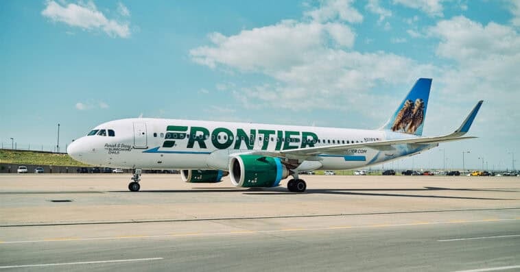 Frontier aircraft halted on runway after fatal pedestrian strike triggers smoke, fire, and emergency evacuation in Denver. | ©Image Credit: Frontier