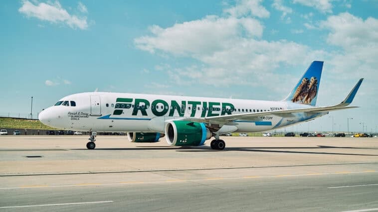 Frontier aircraft halted on runway after fatal pedestrian strike triggers smoke, fire, and emergency evacuation in Denver. | ©Image Credit: Frontier