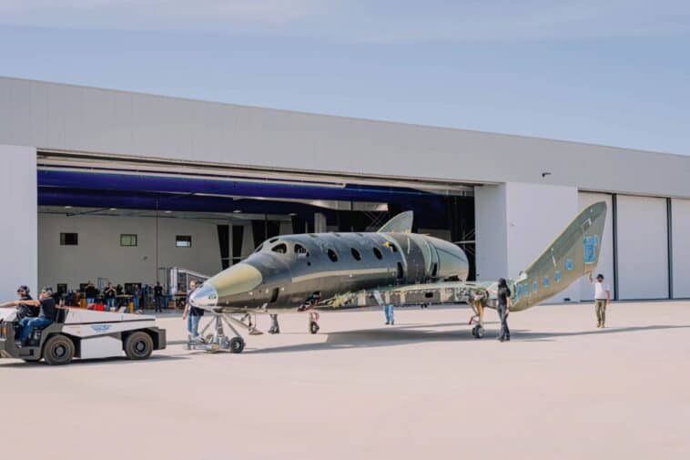 Virgin Galactic’s first next-generation Delta-class spaceship is towed into the Test-and-Launch hangar at its Phoenix facility | ©Image Credit: Virgin Galactic
