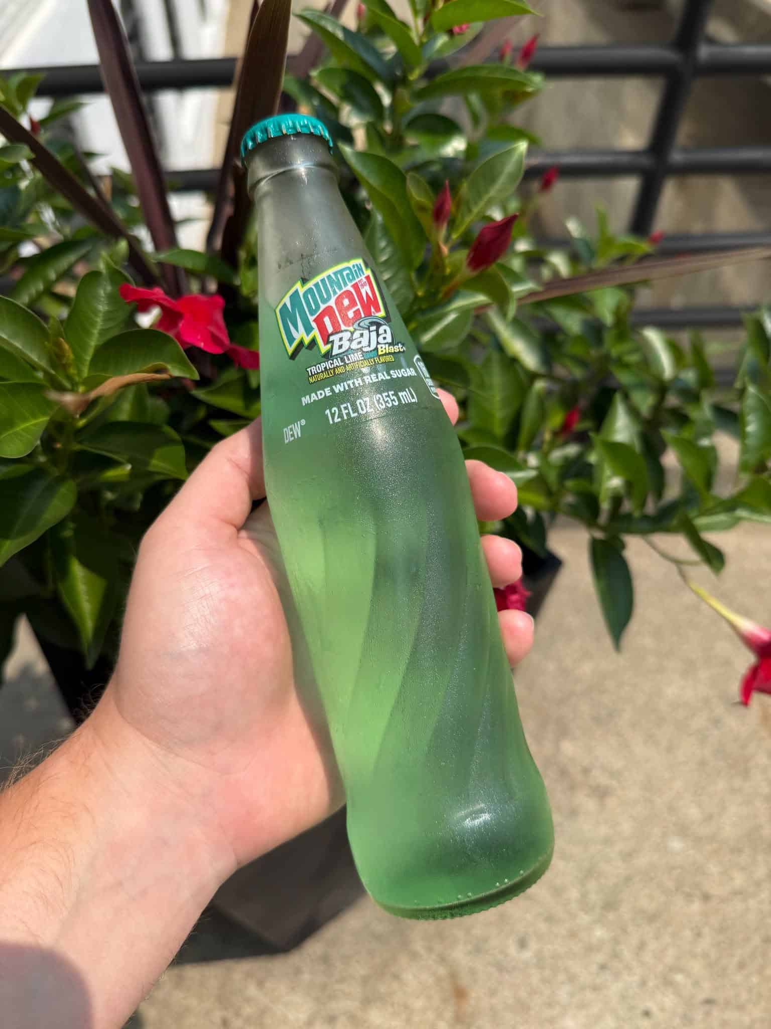 Your favorite tropical soda is getting a massive upgrade: Baja Blast in a glass bottle is finally here. ©Image Credit: Mountain Dew