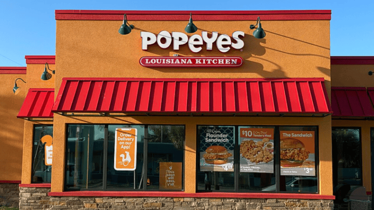 A Popeyes storefront; the company recently faced backlash after a self-service kiosk began prompting customers for tips | ©Image Credit: Wikimedia Commons / Phillip Pessar