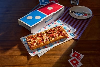 Domino’s, the world’s largest pizza company, is finally launching a menu item named after itself: The Domino. ©Image Credit: Domino’s