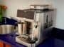 Front angle view of the stainless steel Ninja AutoBarista Pro espresso machine sitting on a kitchen countertop