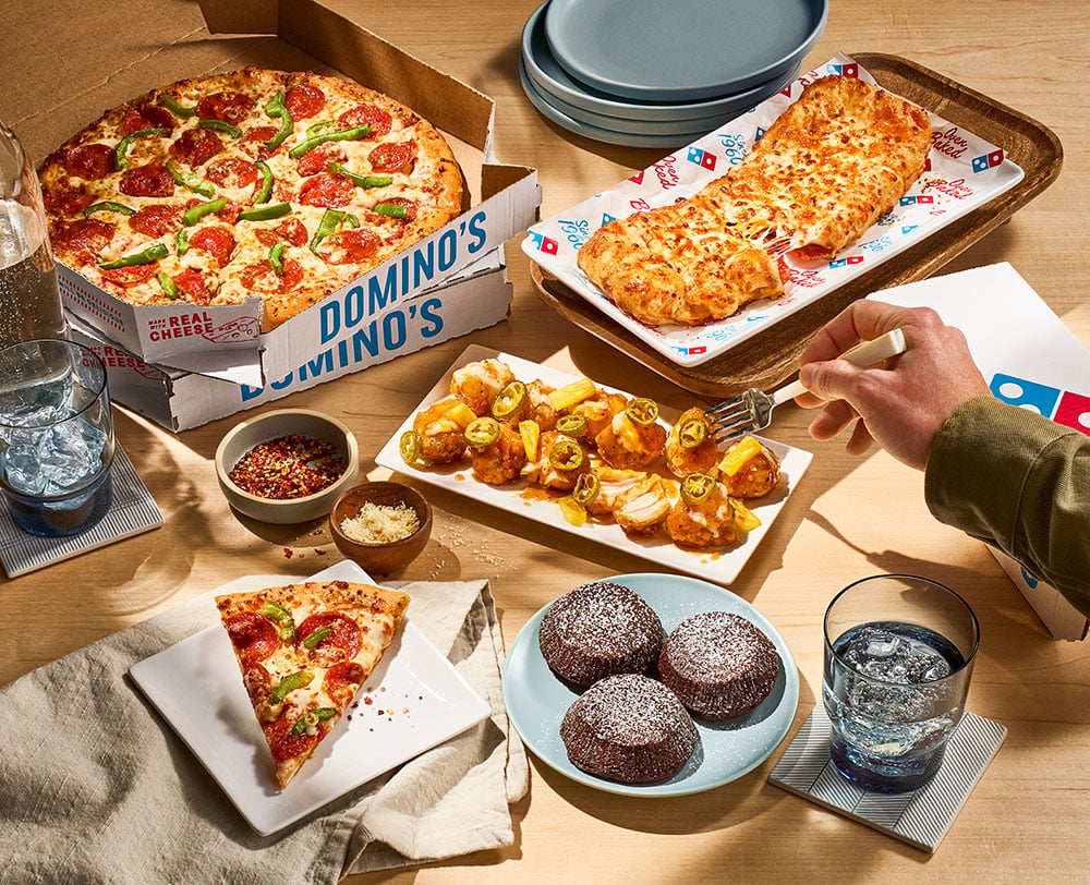 With a traditional circular pizza, someone usually ends up settling for toppings they didn't really want. ©Image Credit: Domino’s