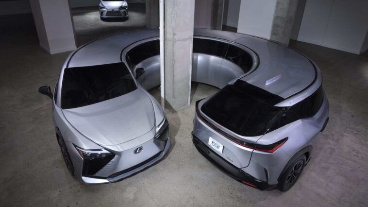Circle Car: A fully electric Lexus RZ 450e bent nose-to-tail into an unbroken loop, frozen in an infinite donut.