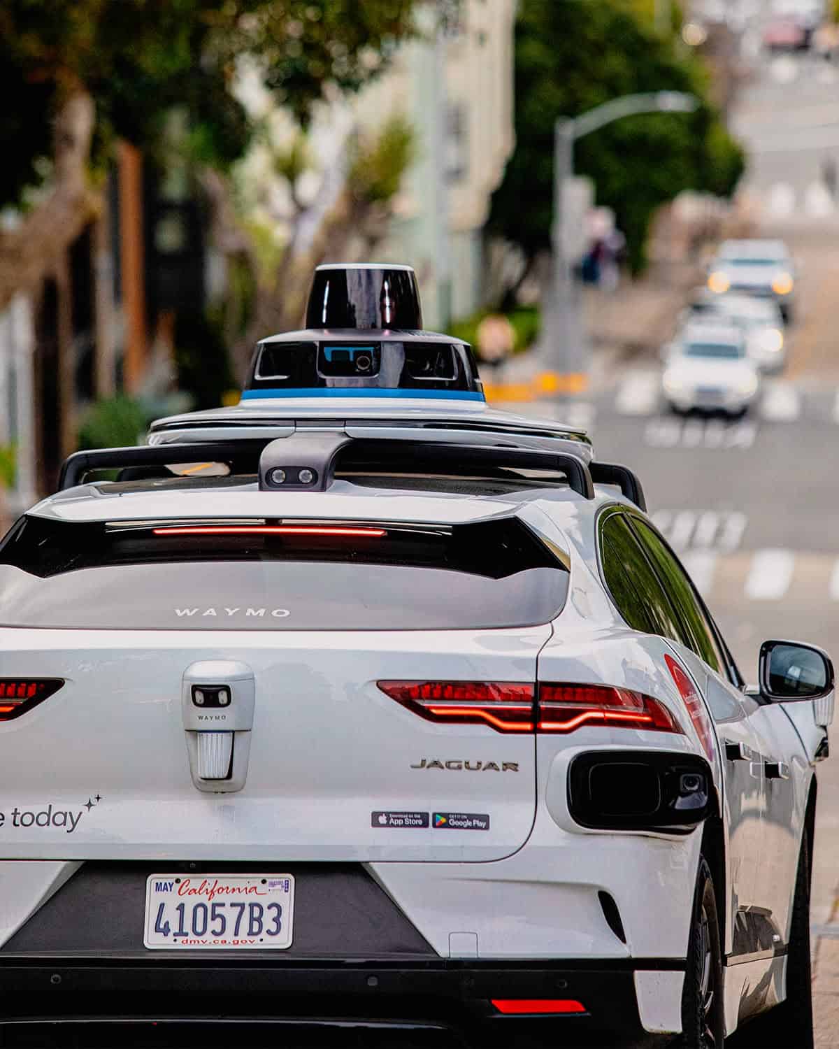 Human drivers say Waymo’s self-driving cars are taking away their most profitable rides and are pushing for a "robotaxi impact fee" as autonomous fleets cut into rideshare pay. ©Image Credit: Facebook / Waymo