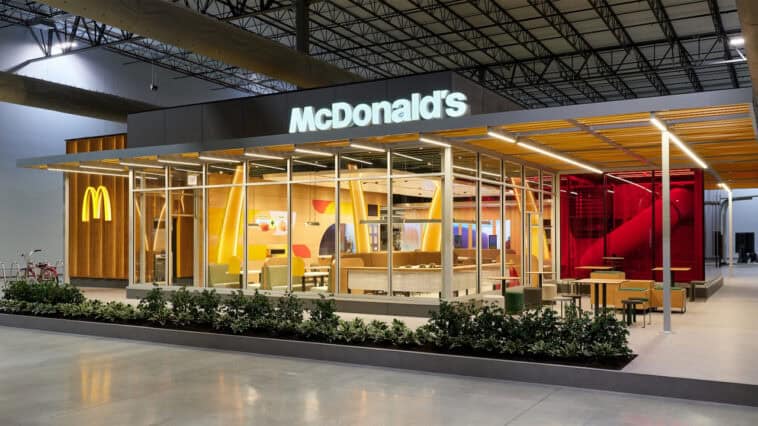 McDonald’s restaurants are about to look very different 1 The exterior of a remodeled McDonald’s restaurant, featuring modern lighting and expanded dining spaces for customers. | ©Image Credit: McDonald's