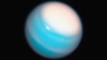 Uranus’ moon Ariel may have once hidden a vast ocean beneath its frozen surface | ©Image Credit: Unsplash / NASA Hubble Space Telescope