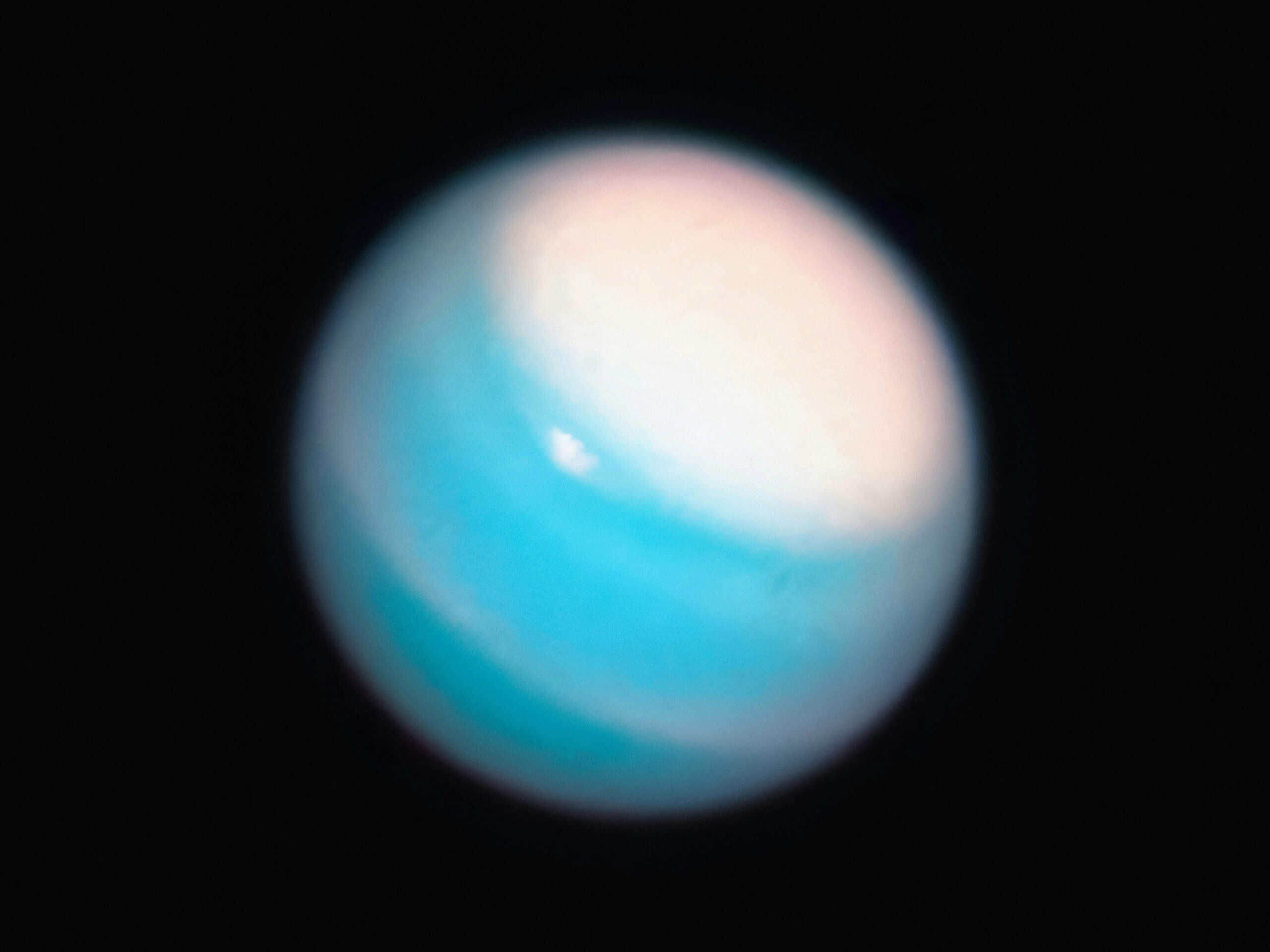 Uranus’ moon Ariel may have once hidden a vast ocean beneath its frozen surface | ©Image Credit: Unsplash / NASA Hubble Space Telescope