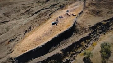 A aerial view of the boat-shaped Durupınar Formation near Mount Ararat, where researchers uncovered charred wood buried 30 feet down. | ©Image Credit: Noah's Ark Scans