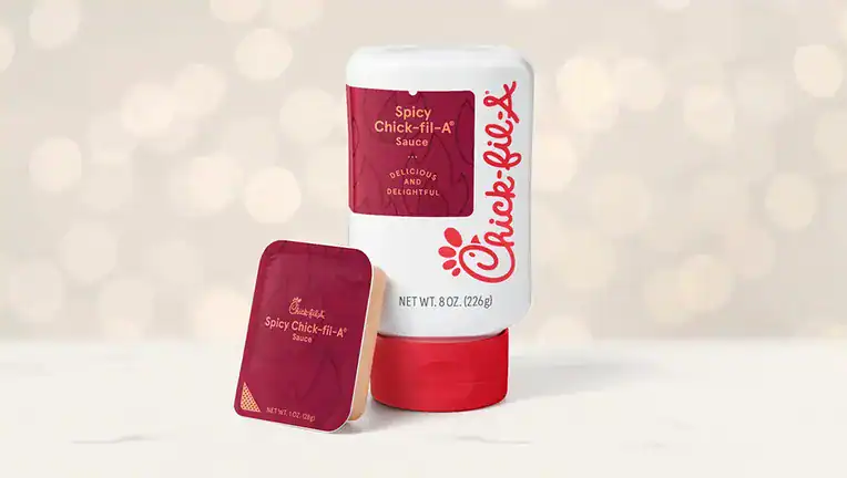 The new Spicy Chick-fil-A Sauce in a standard dipping cup and an 8-ounce bottle, rolls out to restaurants nationwide on November 16 | ©Image Credit: Chick-fil-A